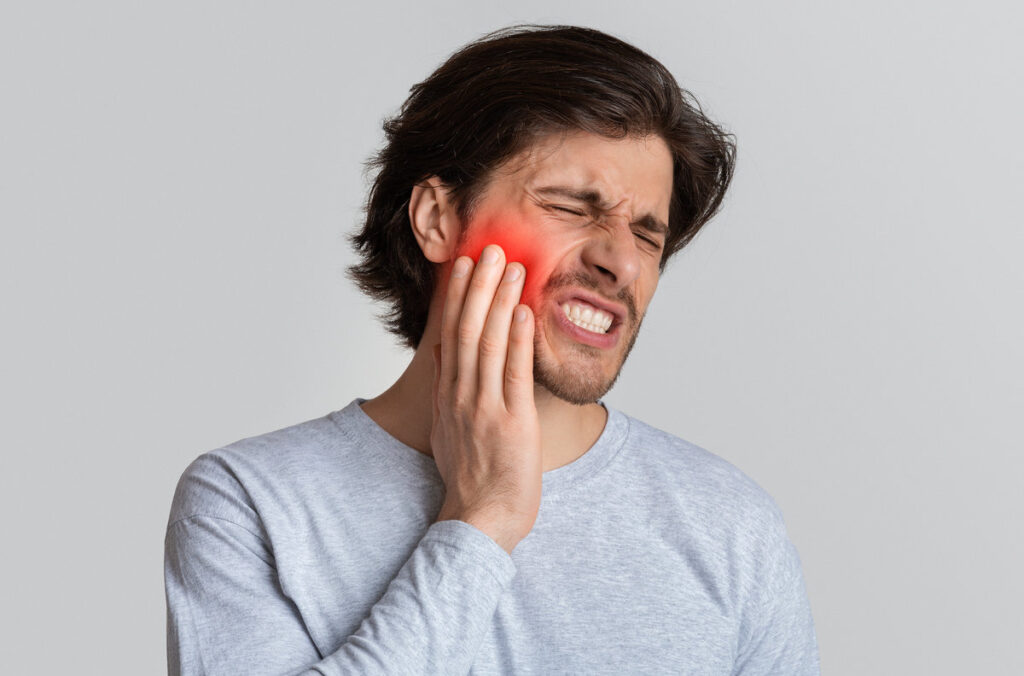 Dental care and health concept. Despaired man endure pain