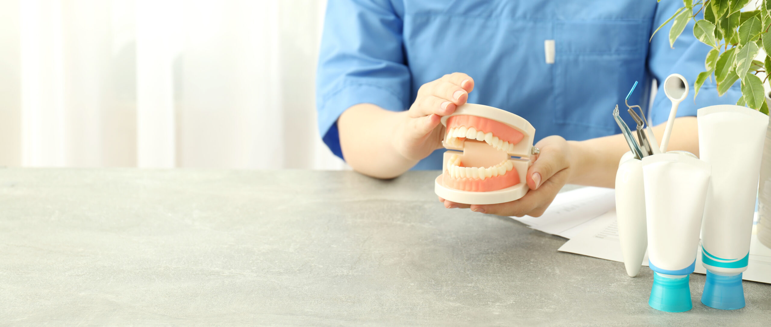 Dental care concept image comparing dental implants and dentures